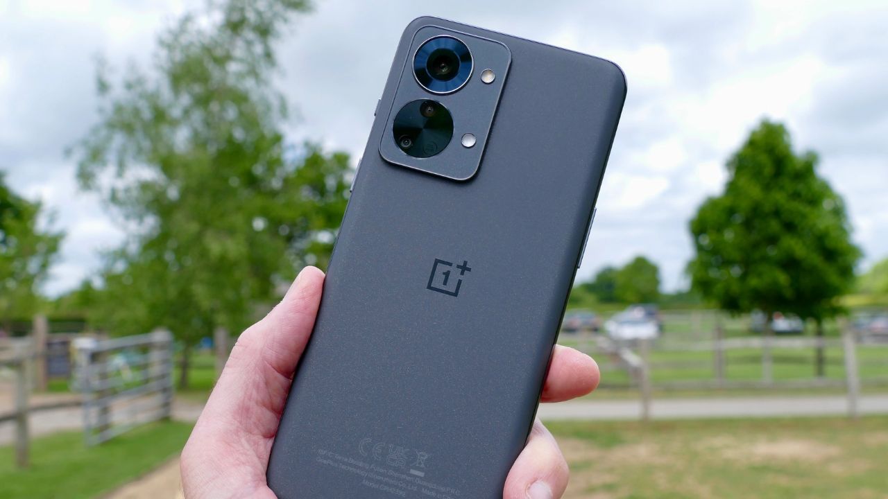 OnePlus Nord 2T 5G in black color in greenry background