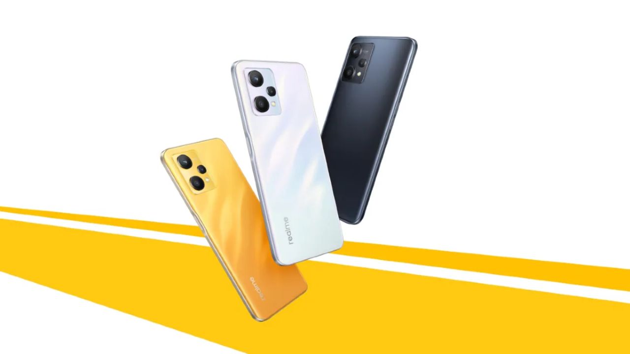 Realme Q5 Carnival Edition in orange white and balck color infront of yellow and white background