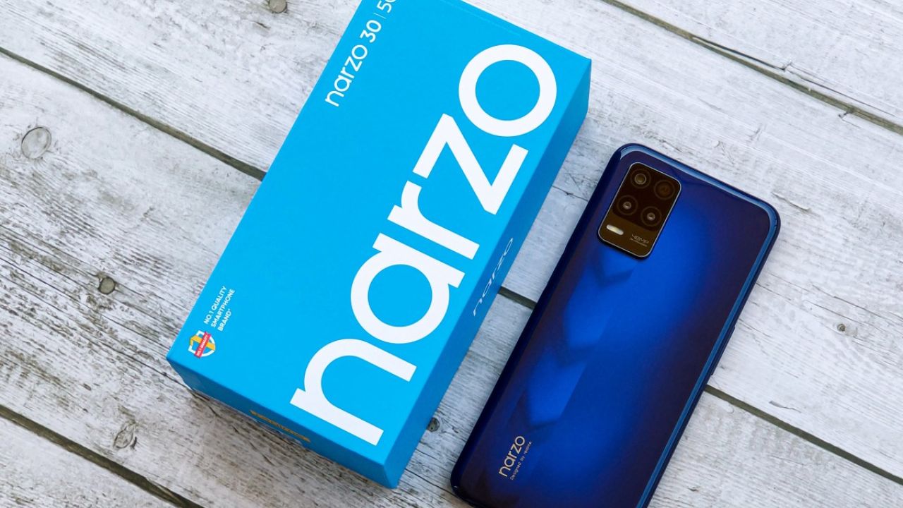 realme Narzo 30 5G in dark blue color with light blue box on table