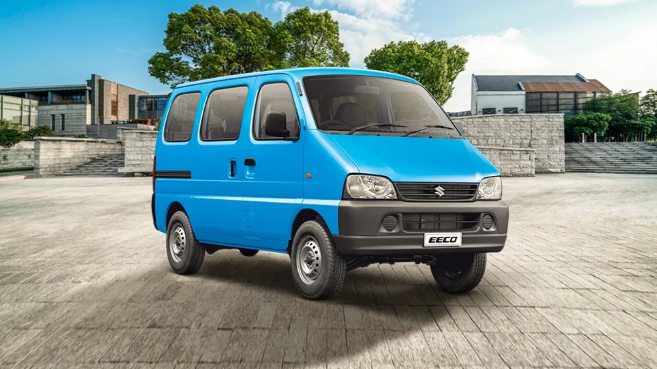 Maruti Suzuki Eeco in blue color near some house and trees