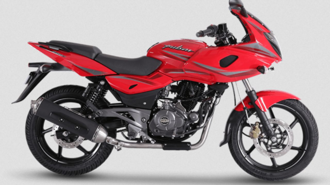 Bajaj Pulsar 220F in red and black color infront of plain white background