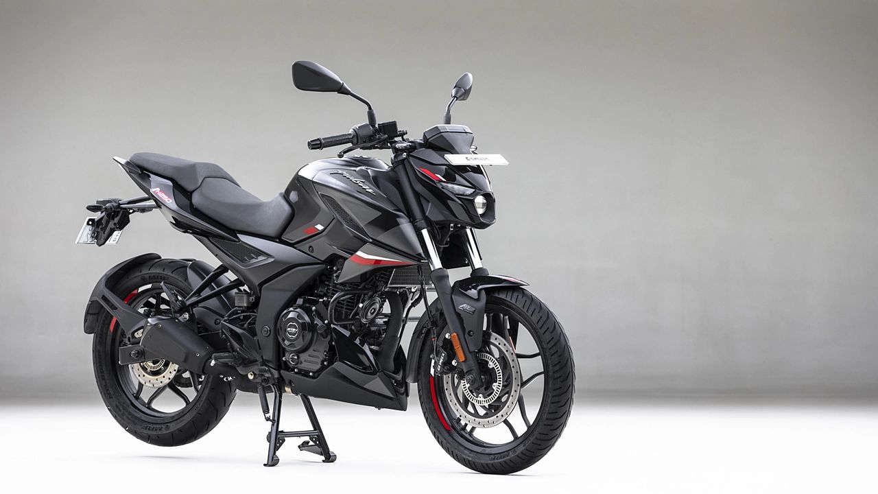 Bajaj Pulsar NS250 in black color infront of plain grey wall