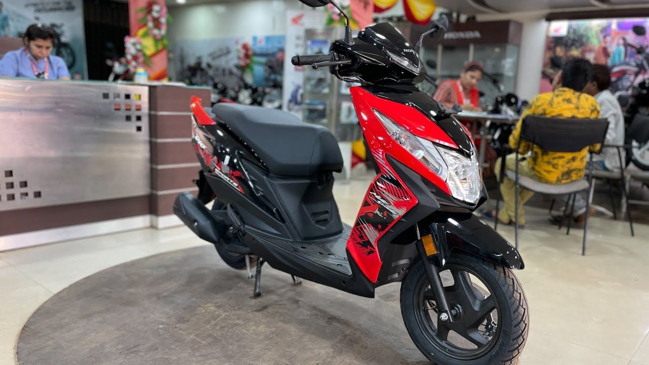 Honda Dio in black and red color in a showroom