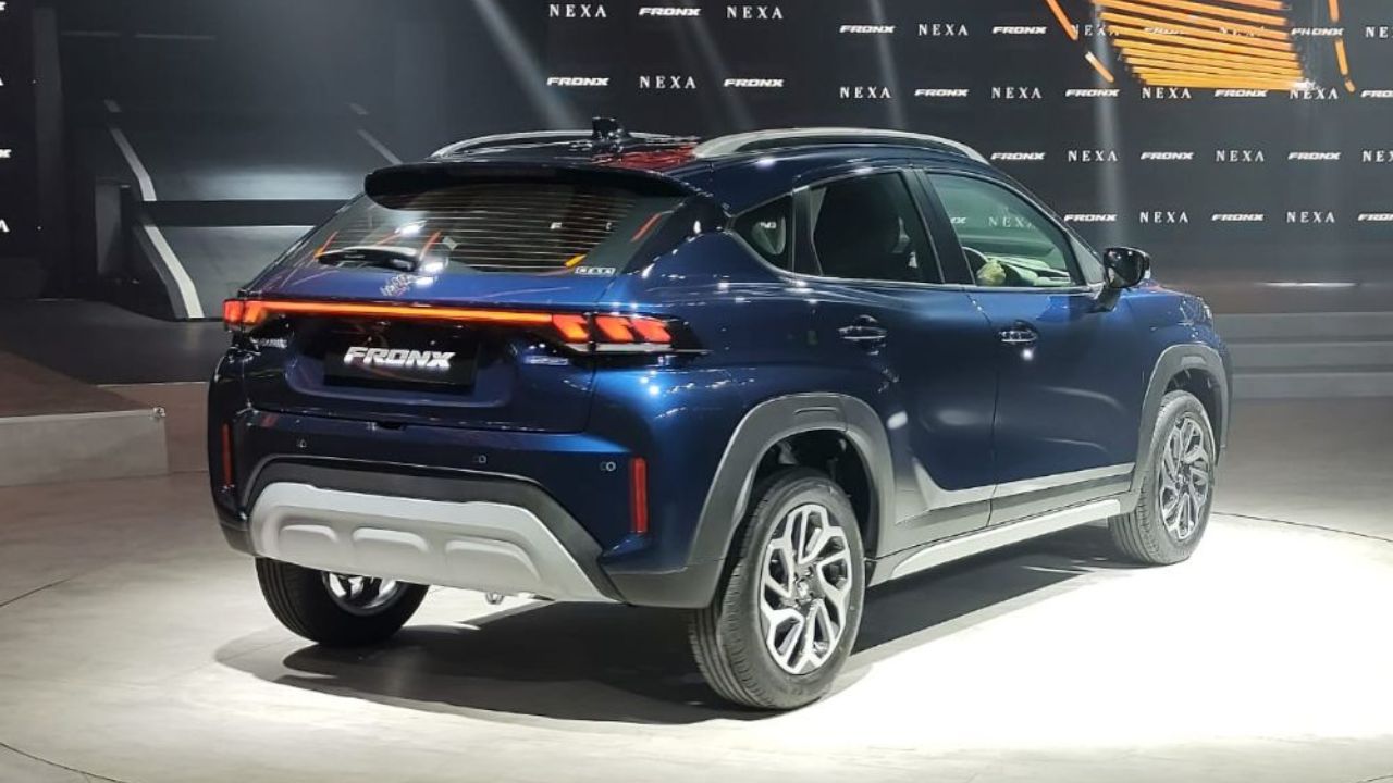 Maruti Fronx SUV in blue color in launch event near ads poster