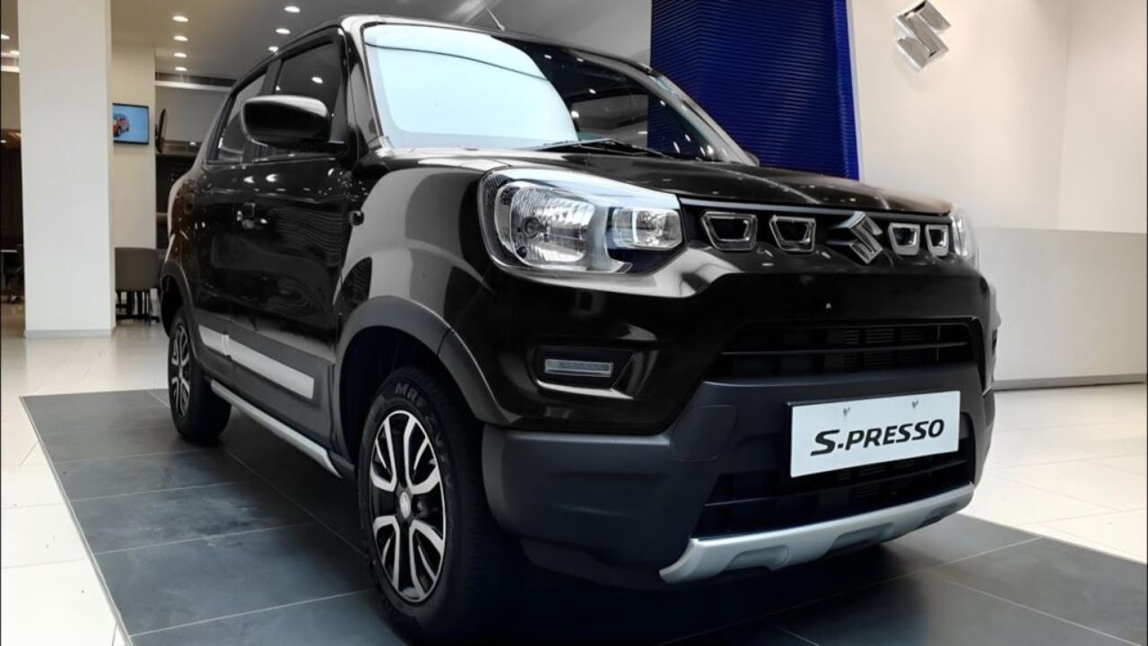 Maruti S Presso in black color in showrrom on plain surface