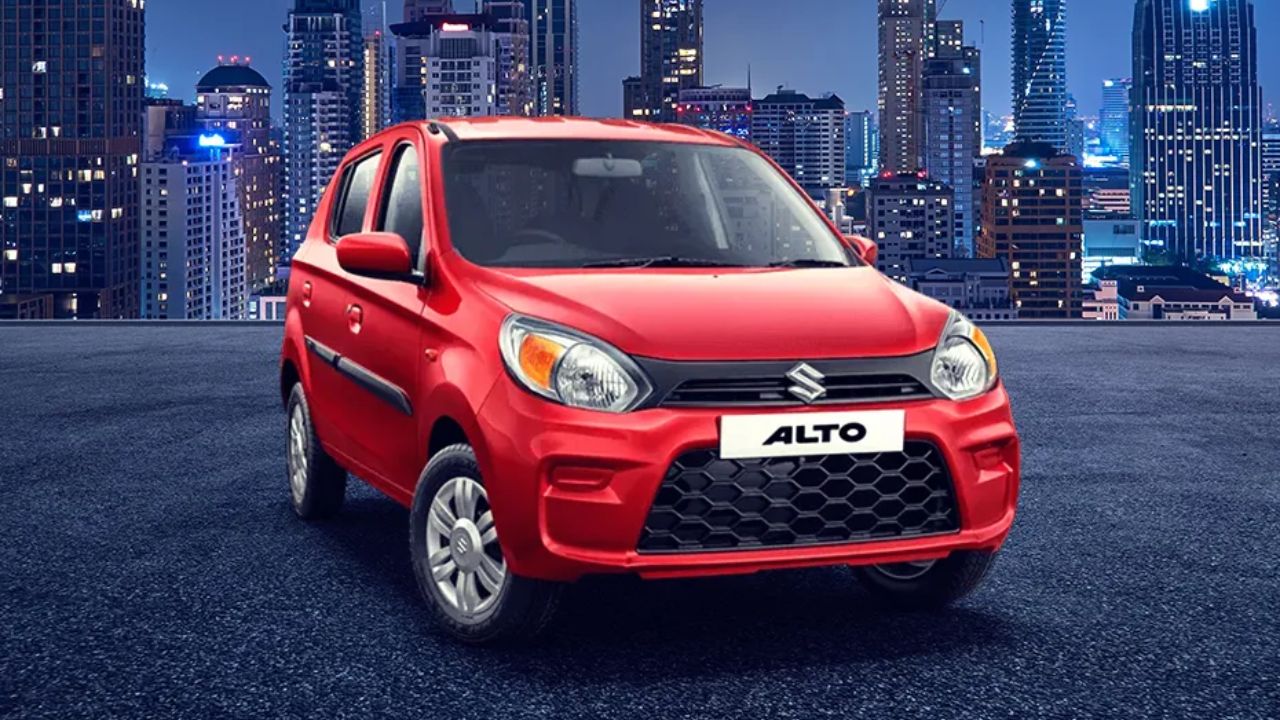 New Maruti Suzuki Alto in red color on road infront of some buildings