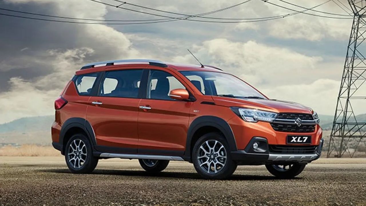 New Maruti Xl7 in orange color on road