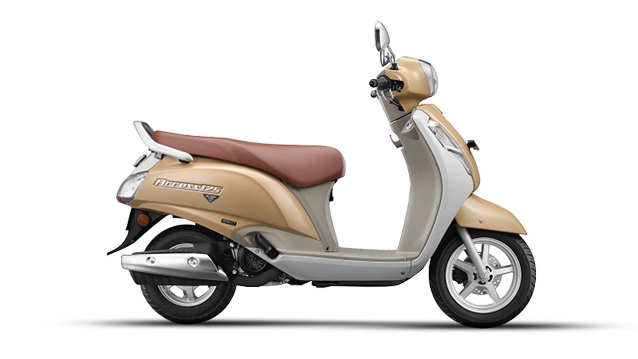 Suzuki Access 125 in light grey and gold color infront of plain white background