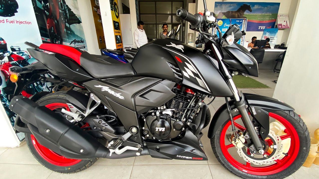 TVS Apache RTR 160 in black and red color in showroom with other bikes