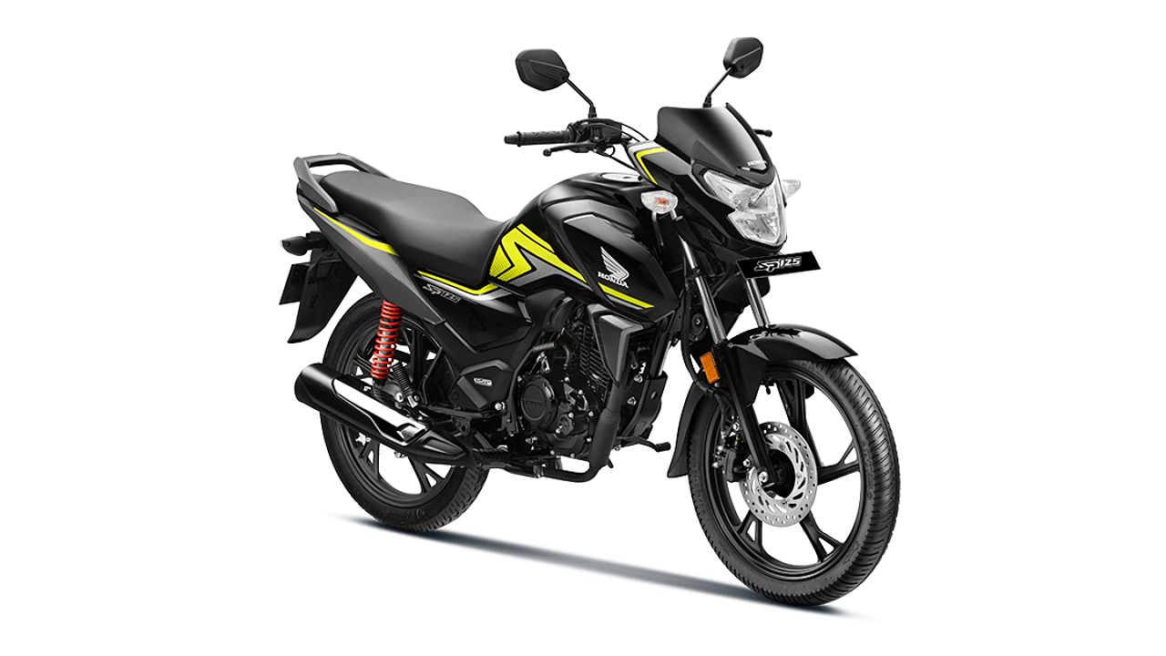 new honda sp 125 in black and green color infront of plain white background