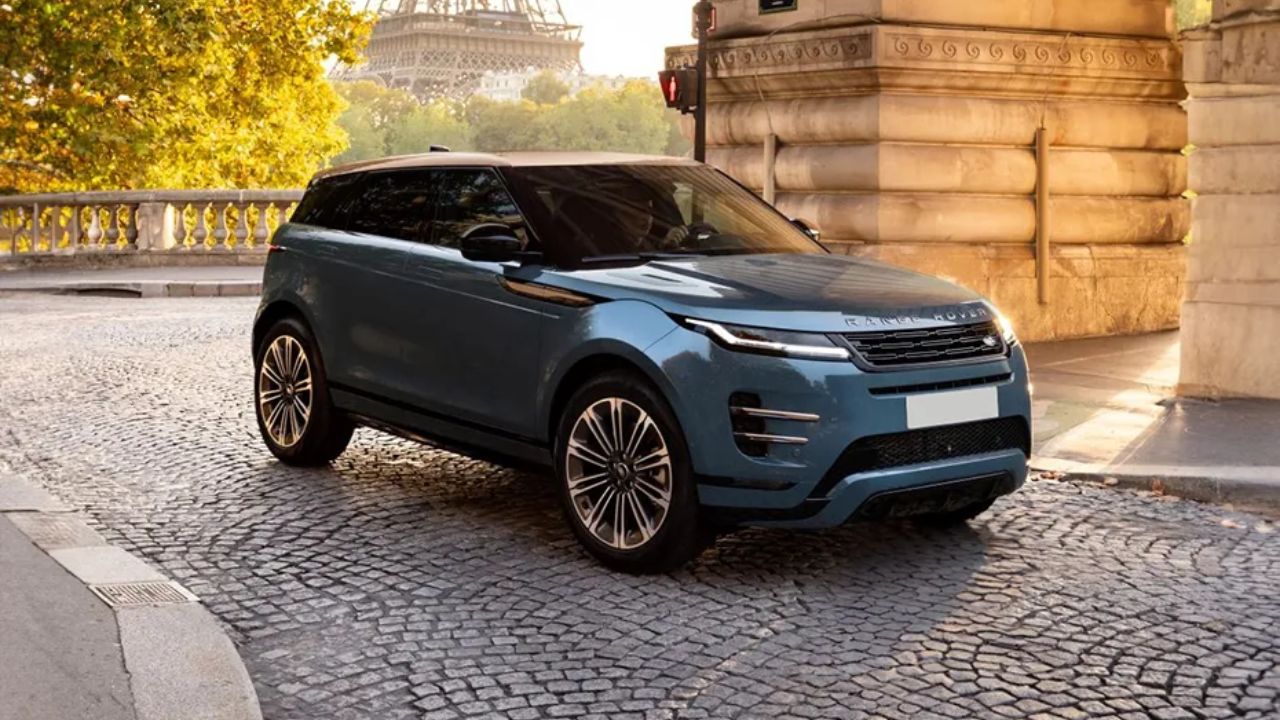 range rover in blue color on road outside a building